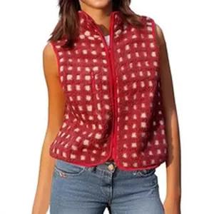 Close-up of a red and white checkered plush fleece vest with front zipper closure.