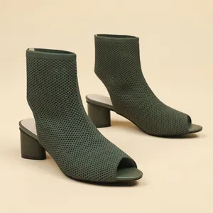 Elegant dark green knitted peep-toe ankle boots featuring a steady chunky heel