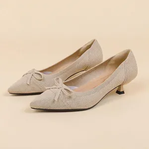 Elegant beige knit pointed-toe pumps with kitten heel and delicate bow knot decoration
