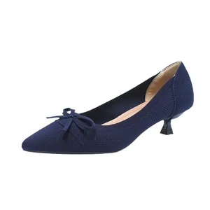 Elegant navy blue knit pointed-toe pumps with bow accent and low kitten heel for work