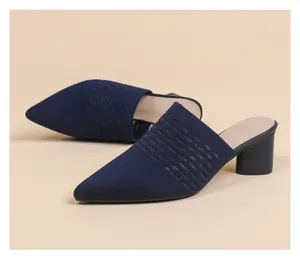 Detailed view of navy blue knitted pointed toe mules with hollow breathable block heels