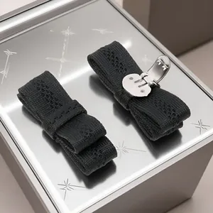 Elegant pair of black knitted bow shoe clips with intricate hollow patterns for JK style