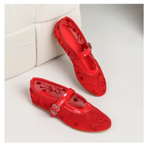 Close-up view of red breathable mesh Mary Jane shoes featuring elegant floral embroidery