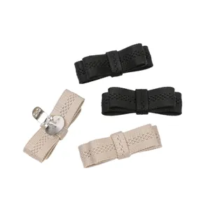 Elegant knitted bow shoe clips in black and beige for fashionable footwear decoration