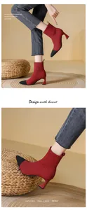 Detailed close-up of red and black knit pointed-toe high heel ankle boots for women