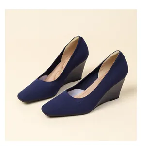 Elegant navy blue knit wedge shoes with a square toe and breathable elastic upper.