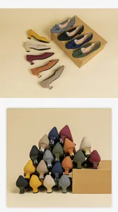 Artistic stack of colorful square toe knit pumps featuring block heels and bow details.