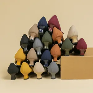 Stack of multi-colored knit square toe pumps with comfortable chunky heels