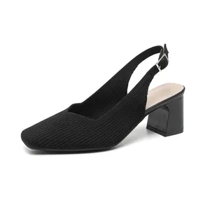 Elegant black ribbed knit slingback sandals with a square toe and chunky heel.