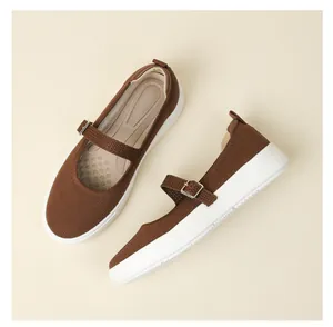Top and side view detail of brown knitted Mary Jane shoes with adjustable buckle strap