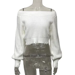 Detail of white off-the-shoulder cropped ribbed knit sweater with distressed hem