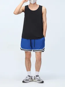 Full body view of men's blue mesh sports shorts with white striped hem and lining
