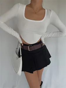 Elegant detail view of a white square neck knitted long sleeve crop top for modern women