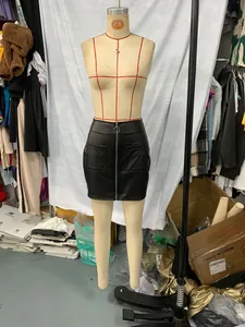 Front view of a black PU leather mini skirt with zipper and pockets on a mannequin