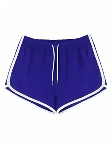Vista frontale dettagliata dei pantaloncini sportivi blu reale da donna con bordo bianco e lacci