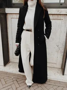 Classic long black wool coat for women in elegant winter street style outfit