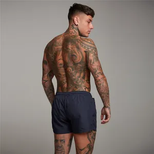Back view of men's navy blue mesh sports shorts for running and fitness