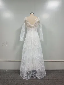 Elegant long-sleeved lace wedding dress with V-neck back and floral embroidery detail