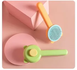 Detail view of bear-shaped grooming brushes for cats and dogs showing bristles and button.