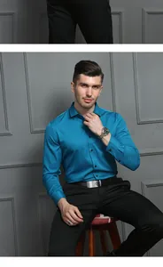 Professional portrait of a man wearing a premium turquoise long-sleeved business shirt.