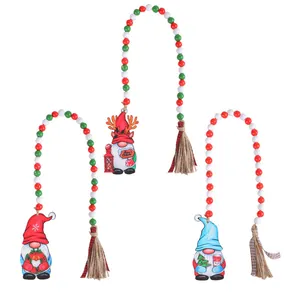Handmade Christmas wooden bead garland with festive gnome charms and hemp tassels