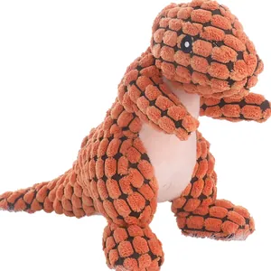 Jouet en peluche dinosaure en velours côtelé orange pour chien sur fond blanc éclatant