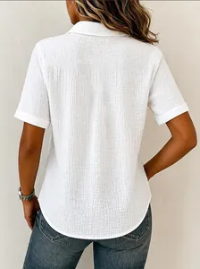 Detailed back view of white cotton short-sleeve shirt with crinkle texture