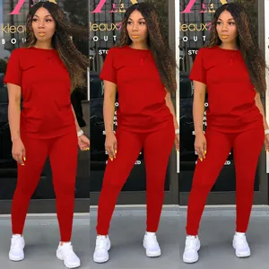 Three-panel view of a women's vibrant red two-piece tracksuit set with t-shirt and pants