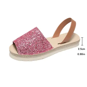 Detail of pink glitter flat sandal with 2.5cm heel height measurement.