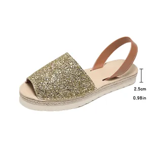 Detail view of stylish gold glitter sandal showing 2.5cm flat heel height dimension