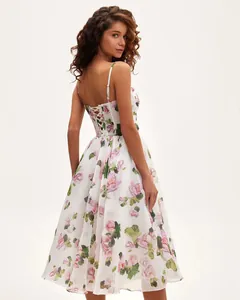 Back view showing the adjustable lace-up detail and romantic rose print on this midi dress