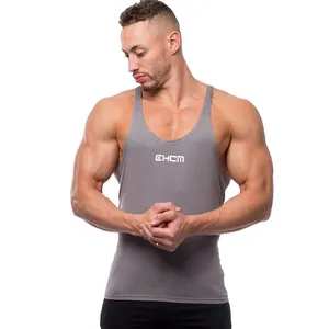 Front view of a grey slim-fit bodybuilding tank top for men on a muscular model