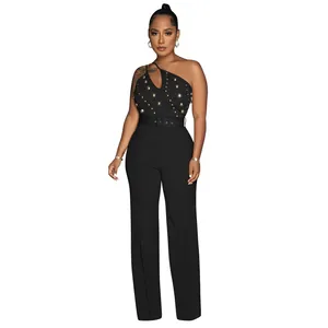 Elegant black one-shoulder jumpsuit with gold studs and wide-leg silhouette