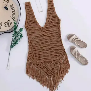 Bohemian crochet beach cover-up with fringe tassels and elegant hollow knit design