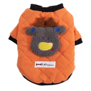 Quilted orange pet vest with cute reindeer patch for winter warmth