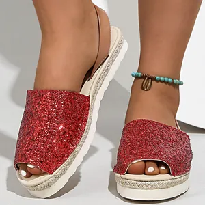 Close-up of sparkling red glitter peep-toe espadrille platform sandals for women