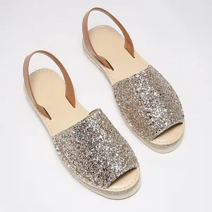 Elegant sparkly glitter flat peep toe sandals with brown straps on a clean white background