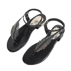 Sandales élégantes pour femmes en noir avec plumes en strass et bride élastique