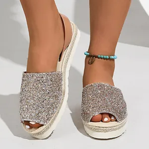 Sparkling glitter peep-toe platform sandals for women on foot model detail view.
