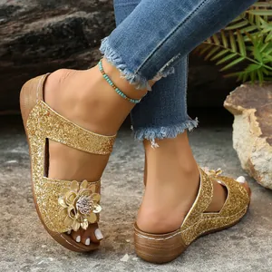 Womens gold glitter wedge sandals with decorative flower detail for summer outdoor wear