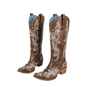 Elegant brown western cowboy boots for women with white floral embroidery and chunky heel