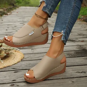 Comfortable beige platform wedge sandals for women styled on a wooden boardwalk