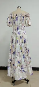 Full-length view of elegant floral print off-the-shoulder organza tiered maxi dress detail