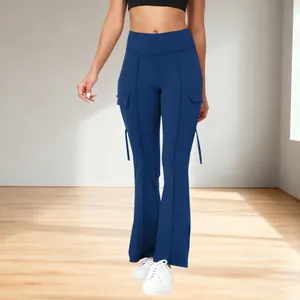 Detail view of navy blue high-waisted flare yoga pants with functional cargo pockets