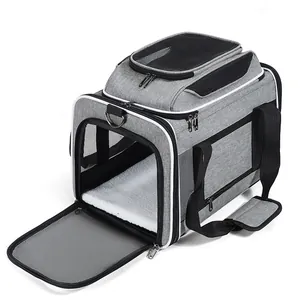 Close-up detail of a breathable gray pet carrier featuring a soft white fleece interior mat