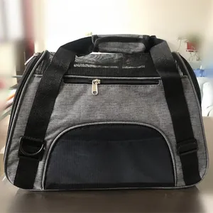 Durable and breathable gray pet carrier bag featuring black mesh windows and sturdy handles