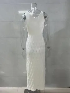 Detailed back view of a white hollow-out knit maxi dress featuring diamond textures