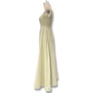 Detailed side view of elegant sleeveless square neck maxi dress on a white mannequin