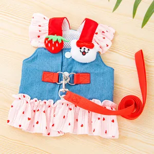 Detail of a cute denim pet harness dress with heart print skirt and plush decor