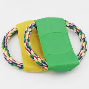 Detailed view of green and yellow canvas rope flying discs for dog outdoor training.